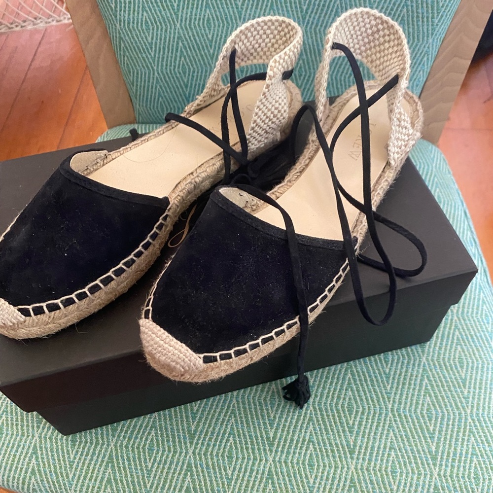Suede espadrilles with lace up suede ties.  Made in Spain